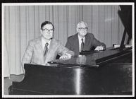 Photograph of Dean Everett Pittman and Assistant Dean Charles Stevens sitting at pianos